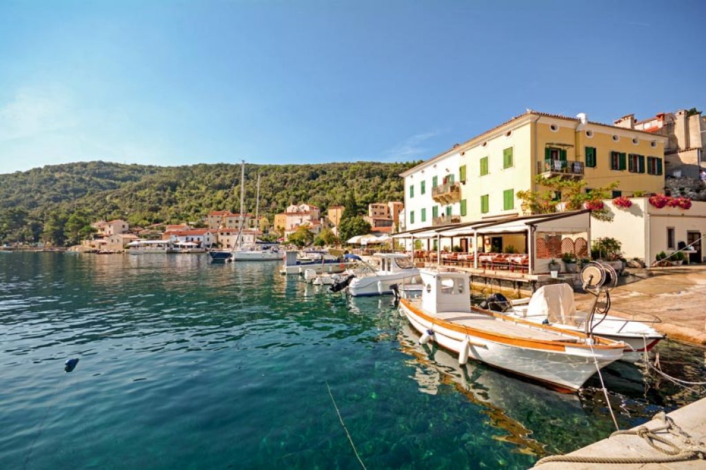 Cres Island, Croatia: View to the village Valun with jetty and b